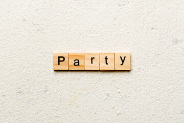 PARTY word written on wood block. PARTY text on cement table for your desing, concept