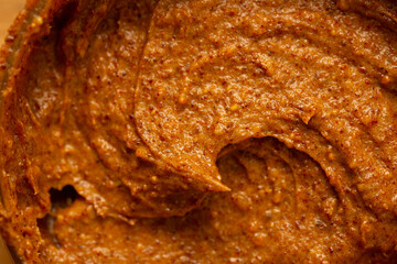 Baby food, vegetable puree close-up. Apple-carrot puree chopped in a blender. Background texture of food for newborn children.