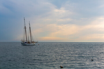 Fototapeta na wymiar lake Garda sailing ship moored offshore