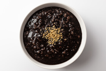 five grain black sesame congee on a white background