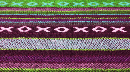 Closeup of Pattern and Texture of Deep Purple and Olive Green Thai Northern Region's Traditional Textile