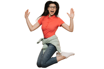 Young brunette girl in glasses, wearing red t-shirt, jeans, sweater tied at the waist and white sneakers, jumping high, screaming, raising up hands, enjoying a holiday , over transparent background.