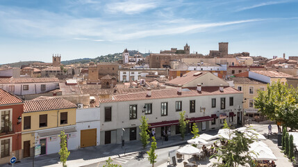 Fototapeta na wymiar Panoramic view at the Cáceres city downtown, Torre Bujaco, Arco de la Estrella and other heritage buildings