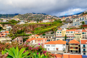 Fototapeta na wymiar view of Camara de lobos city center, Madeira, Portugal on sunny winter day in february