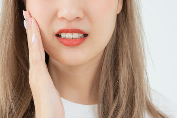 Fototapeta premium Asian woman feel toothache from gingivitis, female suffer tooth, decay problems, dental care. sensitive tooth, decay problem, bad breath, Gingival Recession, Oral Hygiene instruction, tooth extraction