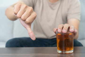 man refuses say no and avoid to drink an alcohol whiskey , stopping hand sign male, alcoholism...