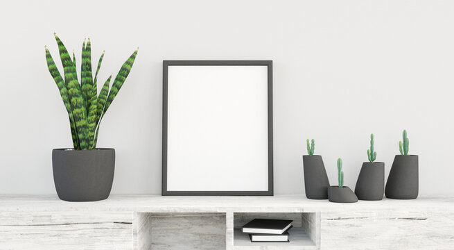 Black vertical frame mockup standing on bedside table decorated with green plants