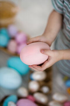 An Easter egg in children's hands.
