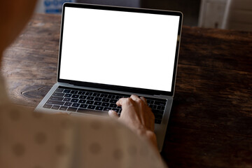 computer screen blank mockup.hand woman work using laptop with white background for advertising,contact business search information on desk at coffee shop.marketing and creative design