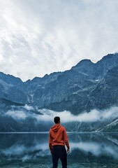 Silhouette of a man on a background of mountains.