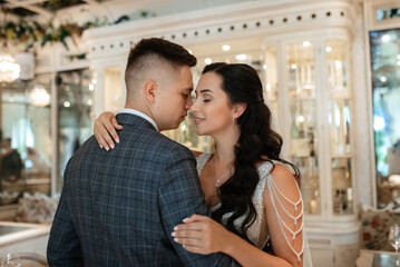 Fototapeta premium bride and groom inside a cocktail bar