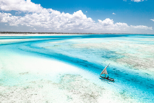 Overhead view of tourist boat on coral reef in the exotic lagoon, Paje, Jambiani, Zanzibar, Tanzania