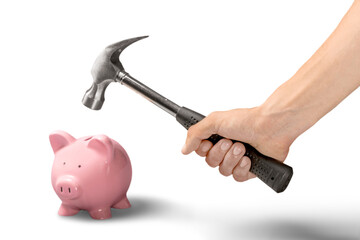 Person smashing piggy bank with hammer on white background