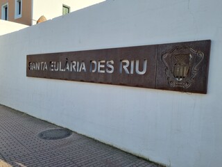 Ibiza, Spain; 6th April 2023: a metal sign that says 'Santa Eularia des Riu' at the entrance of the village