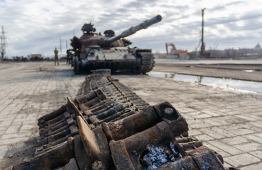 damaged military tank on a city street in Ukraine