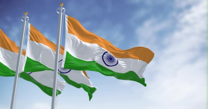 Seamless loop in slow motion of three india national flags waving