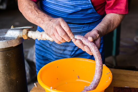 mobile butcher making sausages
