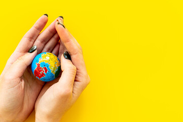 Female hands holding globe. Save the Earth planet ecology concept.