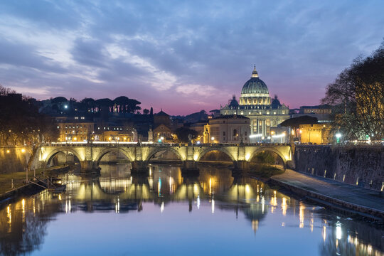 View of the Vatican City at sunset along the Tiber river in Rome downtown, Lazio, Italy.