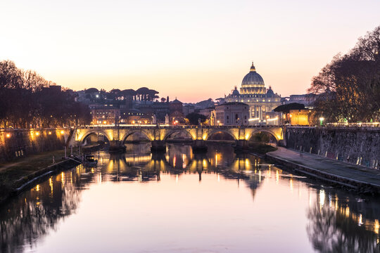 View of the Vatican City at sunset along the Tiber river in Rome downtown, Lazio, Italy.