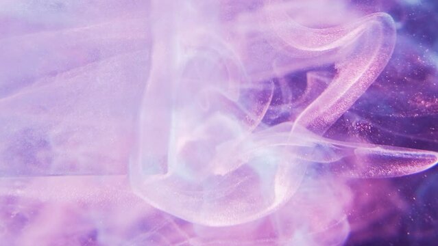 Vertical video. Glitter mist. Color smoke. Aura air. Blue pink purple neon light shimmering fog floating motion abstract background.