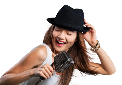 Young woman wearing hat singing into microphone