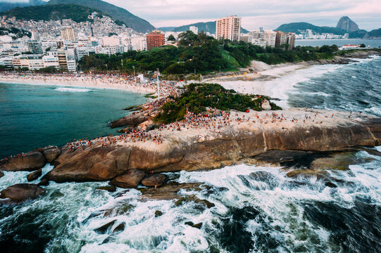 Aerial drone view of Arpoador Rock in Ipanema Beach, with Praia Vermelha visible on right, Rio de Janeiro, Brazil