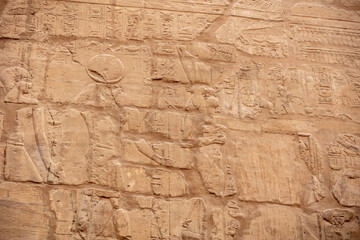 Different hieroglyphs on the walls and columns in the Karnak temple. Karnak temple is the largest complex in ancient Egypt.