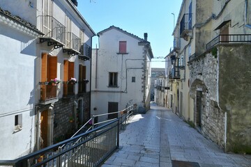 A narrow street among the old houses of Civitacampomarano, a historic town in the state of Molise in Italy.