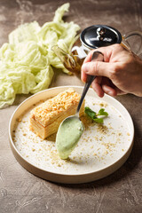 Piece of cake Napoleon puff pastry with custard cream. Russian cuisine, multi layered cake with pastry cream