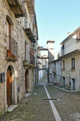 A narrow street among the old houses of Civitacampomarano, a historic town in the state of Molise in Italy.