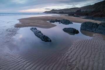 Tidal pools and sand patterns on a deserted Combesgate Beach, North Devon