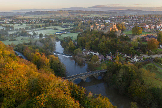 Aerial view of Ludlow Castle above the banks of the River Teme in autumn, Ludlow, Shropshire