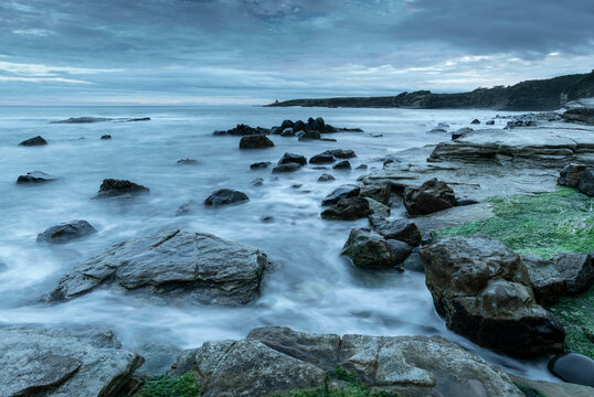 Twilight over the rocky shores of Swine Den near Howick, Northumberland