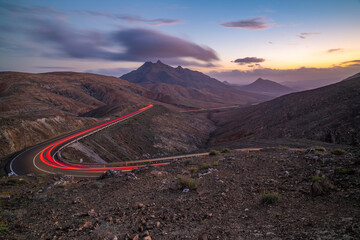 View of road trail lights and mountains from Astronomical viewpoint Sicasumbre at dusk, Pajara, Fuerteventura