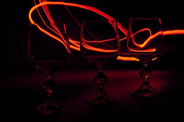 wine glass on black with fire line
