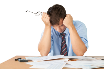 Tired young businessman with many business papers