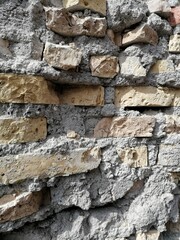 Detail of the section of a concrete and brick wall, demolished for the renovation of a building.