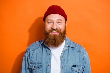 Portrait of satisfied glad young person beaming smile have good mood isolated on orange color background