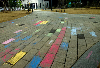 Colorful sidewalk blocks drawn by children with crayons