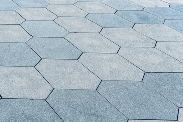 The texture of hexagonal tiled pavement with perspective.