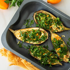 baking sheet with baked eggplant on the table