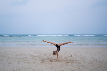 girl gymnast doing a coup over her head