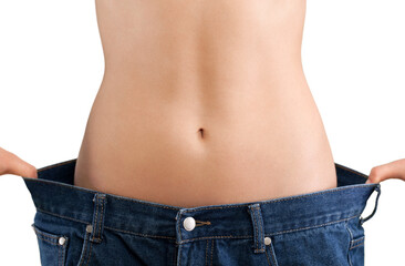 Naklejka premium Young woman showing waist. weight loss concept