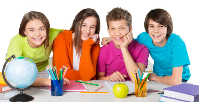 Friendly school children at school studying subject