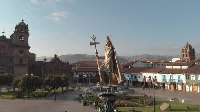 Monument of the Incas in Plaza de Armas in Cusco, Peru at sunset