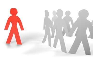 Paper Man Standing out of the Circle of People