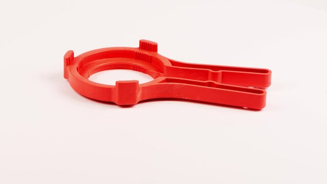 Universal key puller twist-off red color jars with screw caps intended for canning. Side view. Loop motion. Rotation 360. 4K UHD video footage 3840X2160.