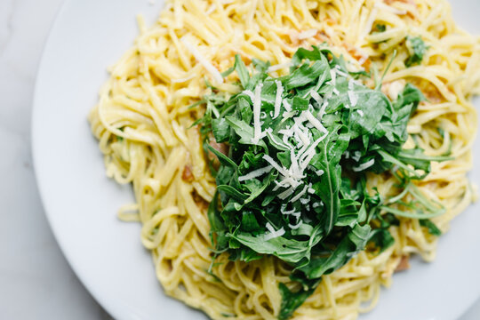 fettuccine carbonara pasta with rocket and parmesan