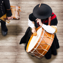 traditional musicians in Galicia with wooden and leather boots and linen costume , Spain